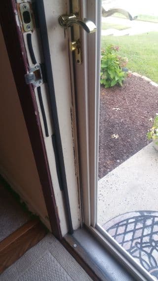 Past Omega Doors and Locks project showing a newly installed front door and trim finish