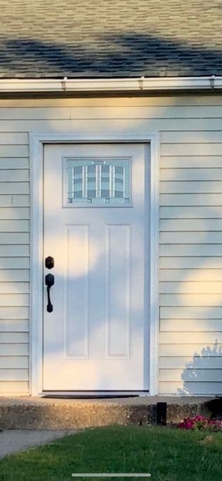 Door replacement job with upgraded entry hardware and secure frame alignment