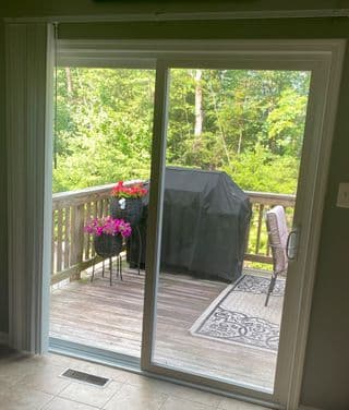 Completed door installation with clean weather-sealed frame and finished threshold